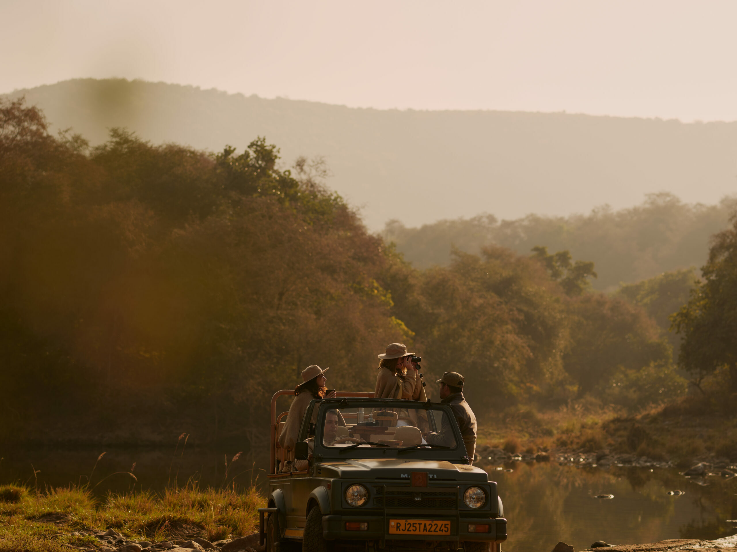 Watch the sunset to the tunes of jungle over the rugged landscape while sipping champagne on a riverbed. 