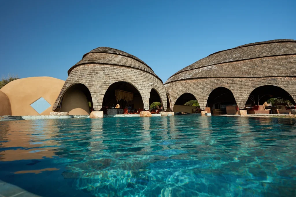 Lounge by the swimming pool which feels like a private lagoon, at sunrise or sunset. 