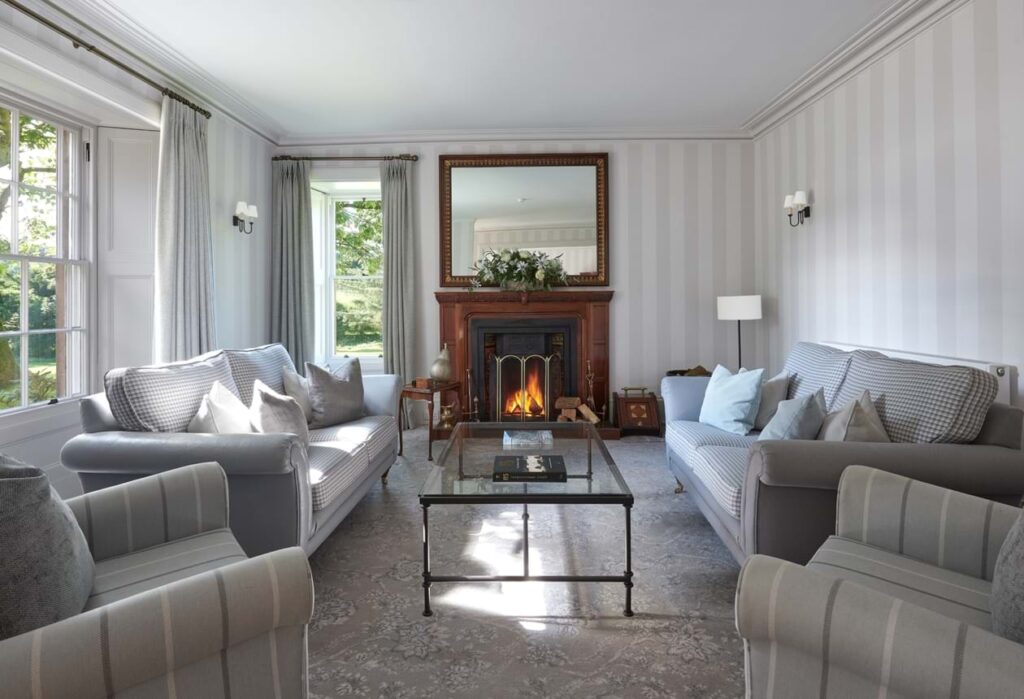 The sitting room is made for long conversations with fireplaces to keep you warm. The library brings a sense of calm. Photo courtesy: Farlam Hall 